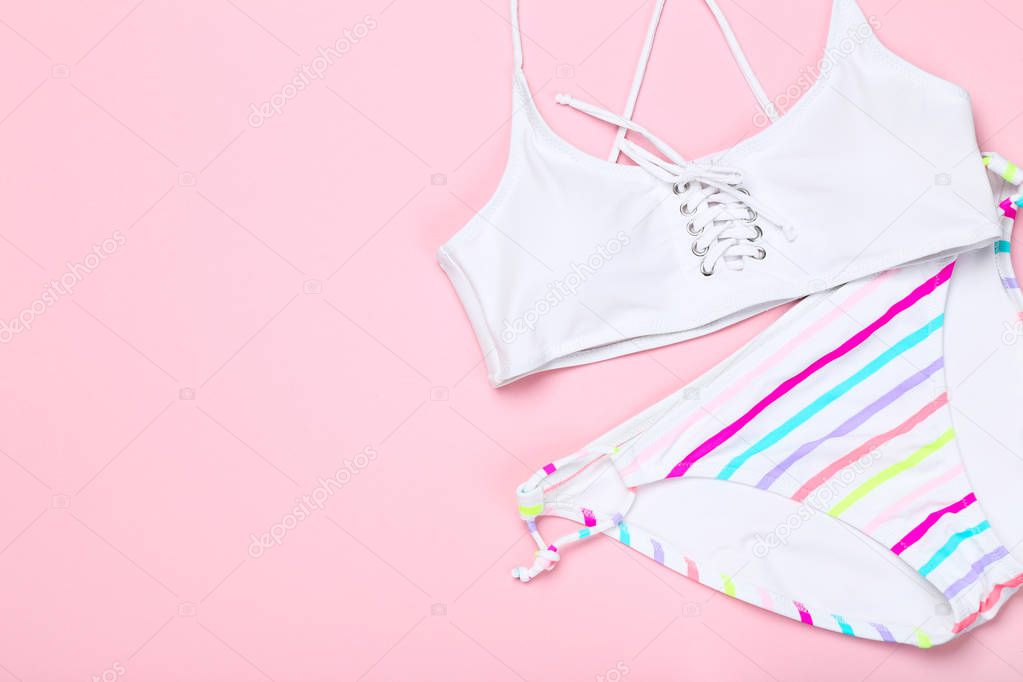 Fashion swimsuit on pink background