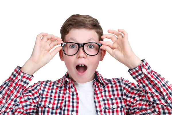 Portrait of young boy in glasses isolated on white background