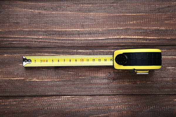 Construction roulette on brown wooden table