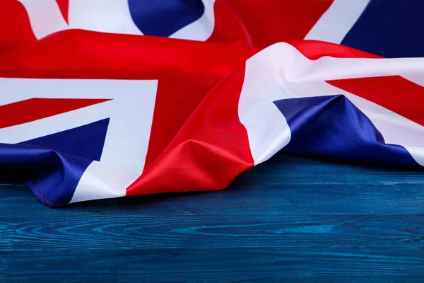 British flag on blue wooden table — Stock Photo, Image