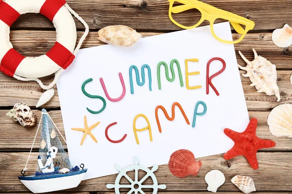 Text Summer camp with seashells, glasses and decorative ship on — Stock Photo, Image