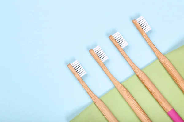 Bamboo toothbrushes on colorful background — Stock Photo, Image