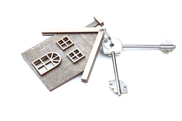 Silver keys with wooden house isolated on white background — Stock Photo, Image