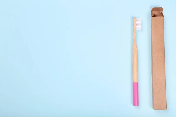 Bamboo toothbrush on blue background — Stock Photo, Image