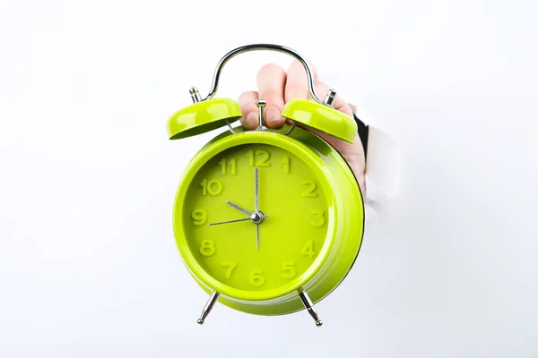 Reloj despertador de mano de papel blanco desgarrado —  Fotos de Stock