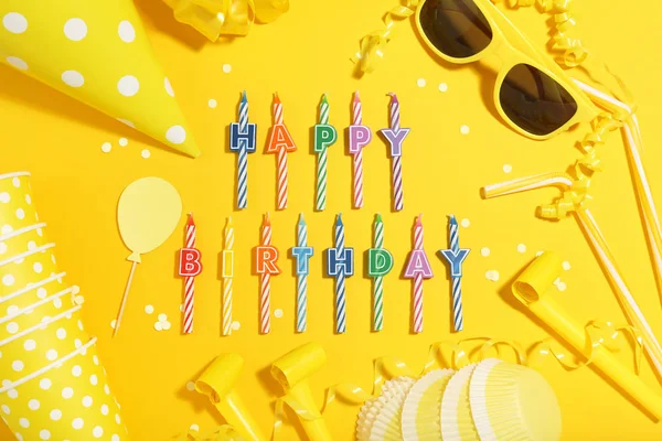 Birthday party decorations on yellow background. Minimalism conc
