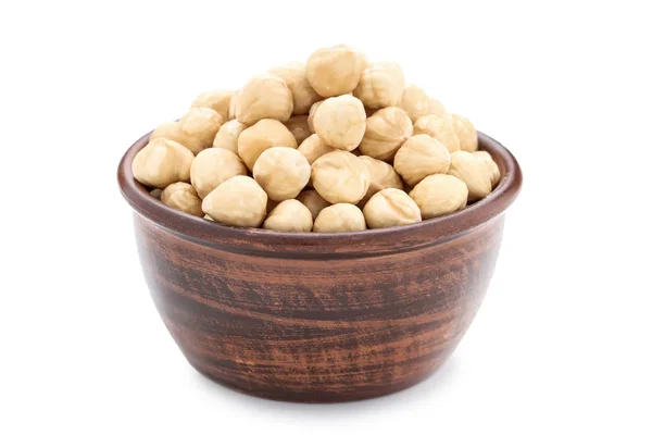 Peeled hazelnuts in bowl on isolated white background — Stock Photo, Image