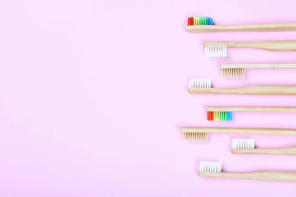 Bamboo toothbrushes on pink background — Stock Photo, Image