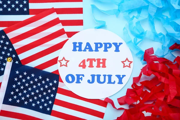 Текст Happy 4th of July with american flags on blue background — стоковое фото