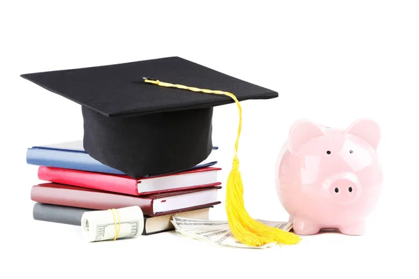 Piggybank with graduation cap, books and dollar banknotes isolat — Stock Photo, Image