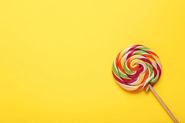 Colorful lollipop on yellow background — Stock Photo, Image