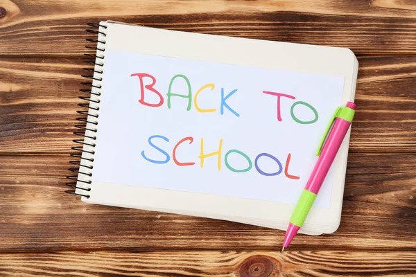 stock image Text Back To School with pen on brown wooden table