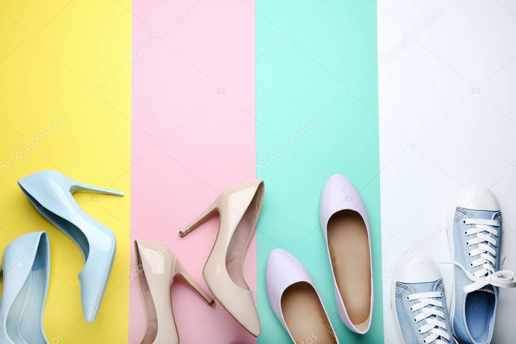 Different female shoes on colorful background