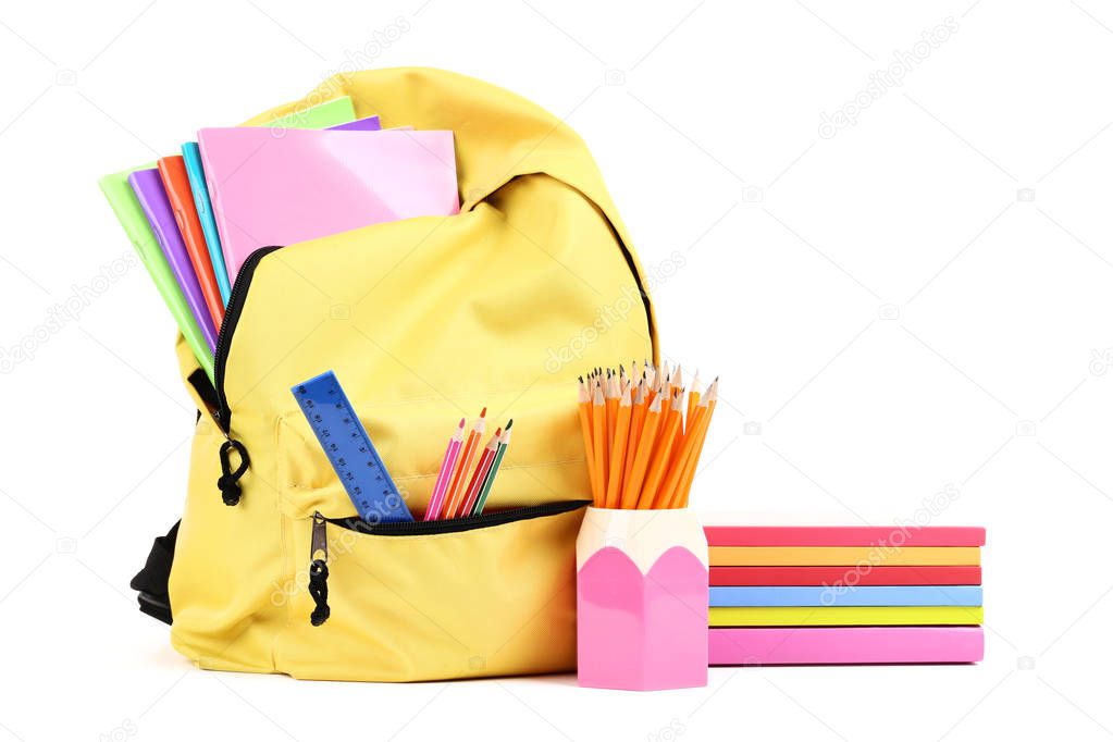Backpack with school supplies isolated on white background