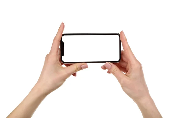 Smartphone em mãos femininas isolado no fundo branco — Fotografia de Stock