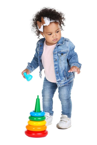 Beautiful baby girl with rainbow toy on white background — Stock Photo, Image