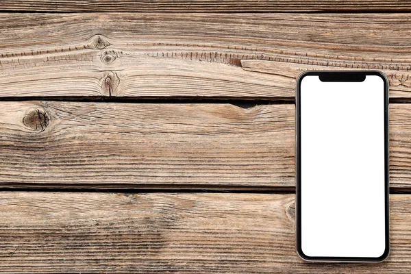 Smartphone na mesa de madeira marrom — Fotografia de Stock