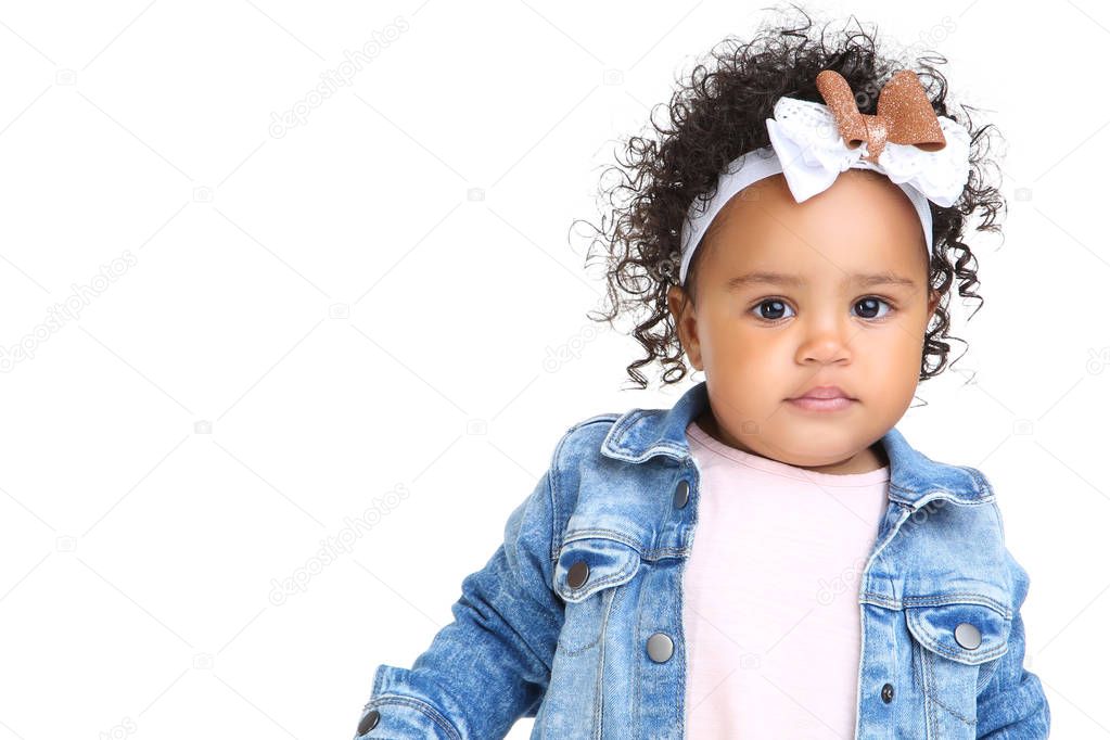 Beautiful baby girl in fashion clothing on white background