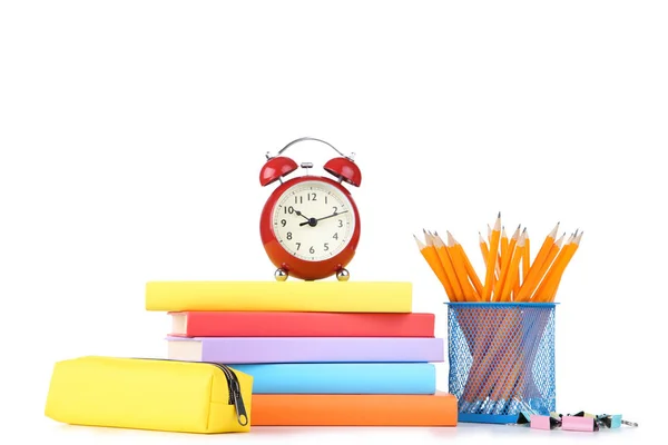 School supplies with red alarm clock on white background — Stock Photo, Image
