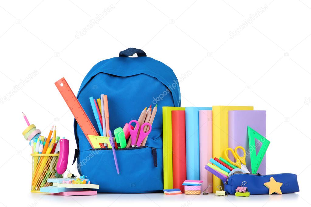 School supplies with blue backpack on white background