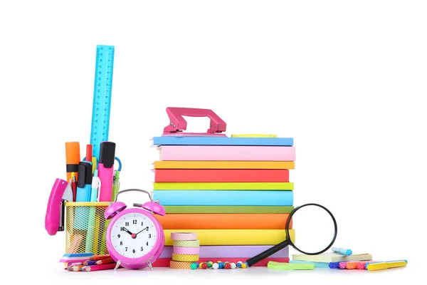 School supplies with stack of books and alarm clock on white bac — Stock Photo, Image