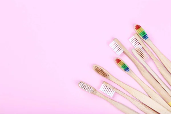 Bamboo toothbrushes on pink background — Stock Photo, Image