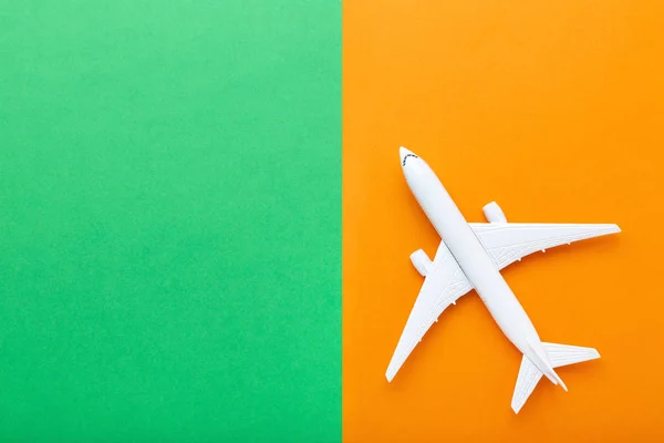 Airplane model on colorful paper background — Stock Photo, Image