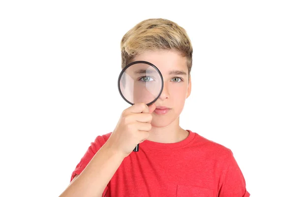 Young boy with magnifying glass on white background — Stock Photo, Image