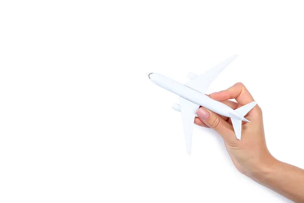 Modelo de avión en mano femenina sobre fondo blanco — Foto de Stock