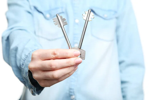 Female hand holding house keys — Stock Photo, Image