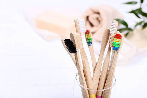 Bamboo toothbrushes in glass