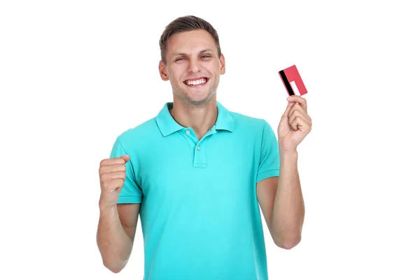 Young man holding credit card isolated on white background Royalty Free Stock Images