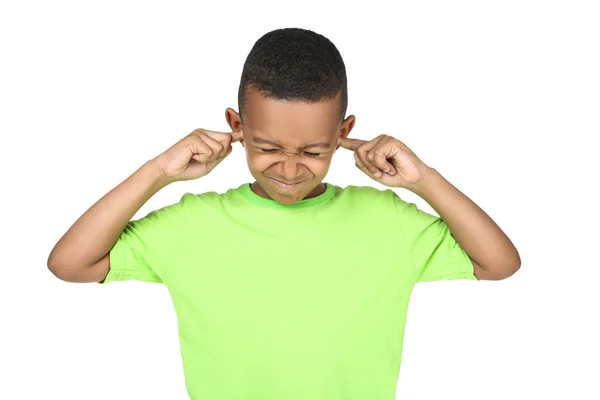 Cute american boy closing ears by fingers on white background — Stock Photo, Image