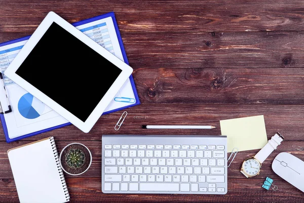 Tablet, keyboard computer with notepad, cactus, mouse and paper