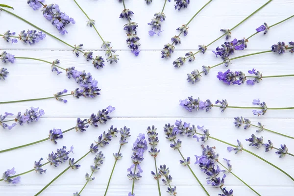 Lavender flowers on white wooden table — Stock Photo, Image