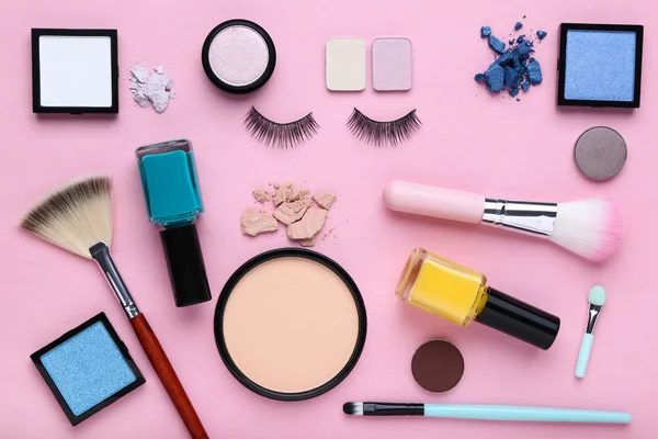 Different makeup cosmetics on pink background — Stock Photo, Image