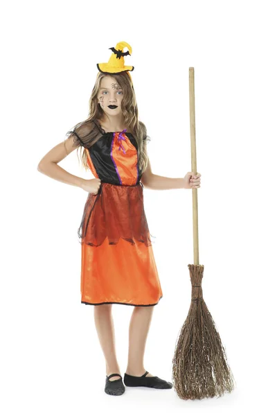 Beautiful girl in halloween costume with broom on white backgrou — Stock Photo, Image