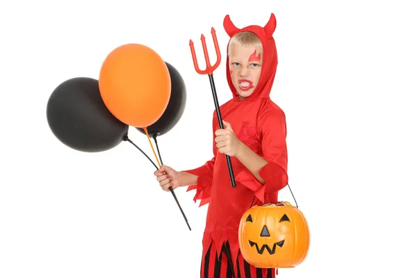 Young boy in halloween costume with pumpkin bucket and balloons — Stock Photo, Image