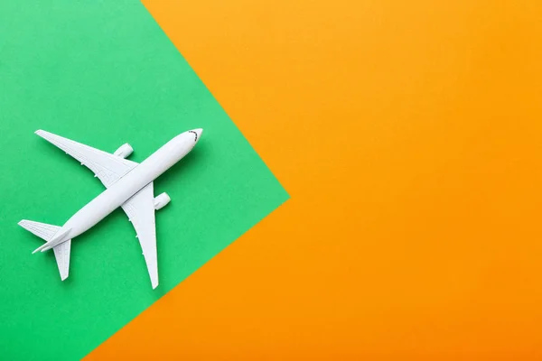 Airplane model on colorful paper background — Stock Photo, Image