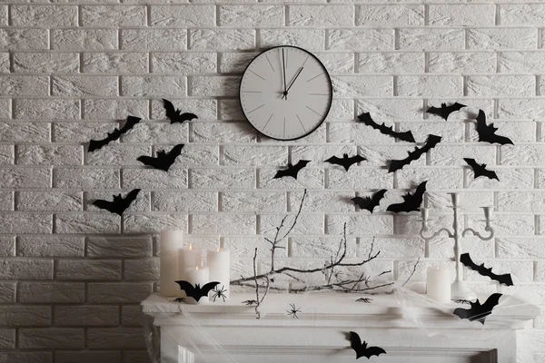 Halloween decorations on white fireplace