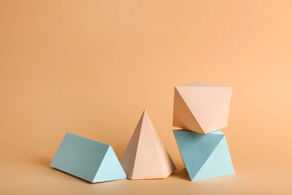 Paper geometric figures on beige background — 스톡 사진