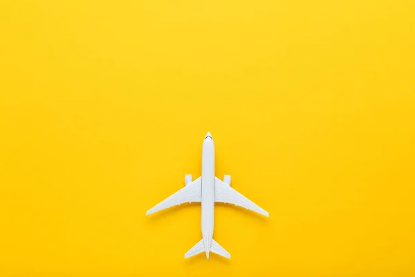 Airplane model on yellow background — Stock Photo, Image