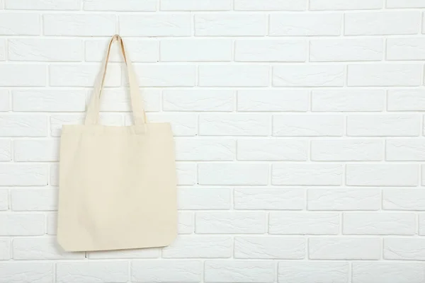 White cotton eco bag on brick wall background — Stock Photo, Image