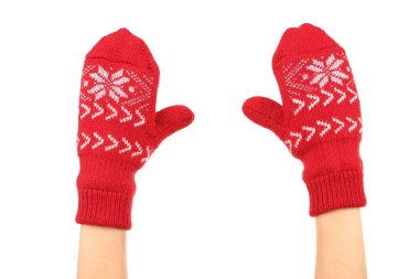 Hands in knitted mittens on white background clipart