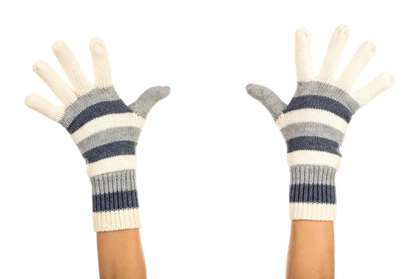 Hände in Strickhandschuhen auf weißem Hintergrund — Stockfoto