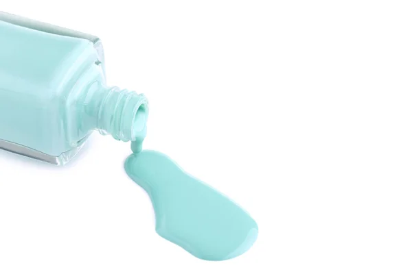 Nail polish splatter and bottle isolated on white background — Stock Photo, Image