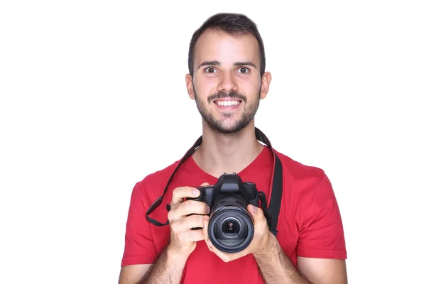 Young photographer with camera on white background — Stock Photo, Image