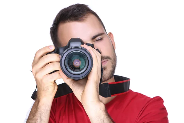 Joven fotógrafo con cámara sobre fondo blanco —  Fotos de Stock