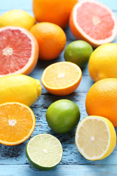 Citrus fruits on blue wooden table — Stock Photo, Image