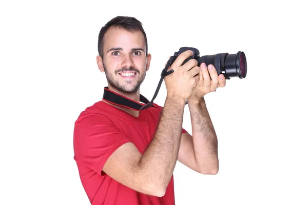 Young photographer with camera on white background — Stock Photo, Image
